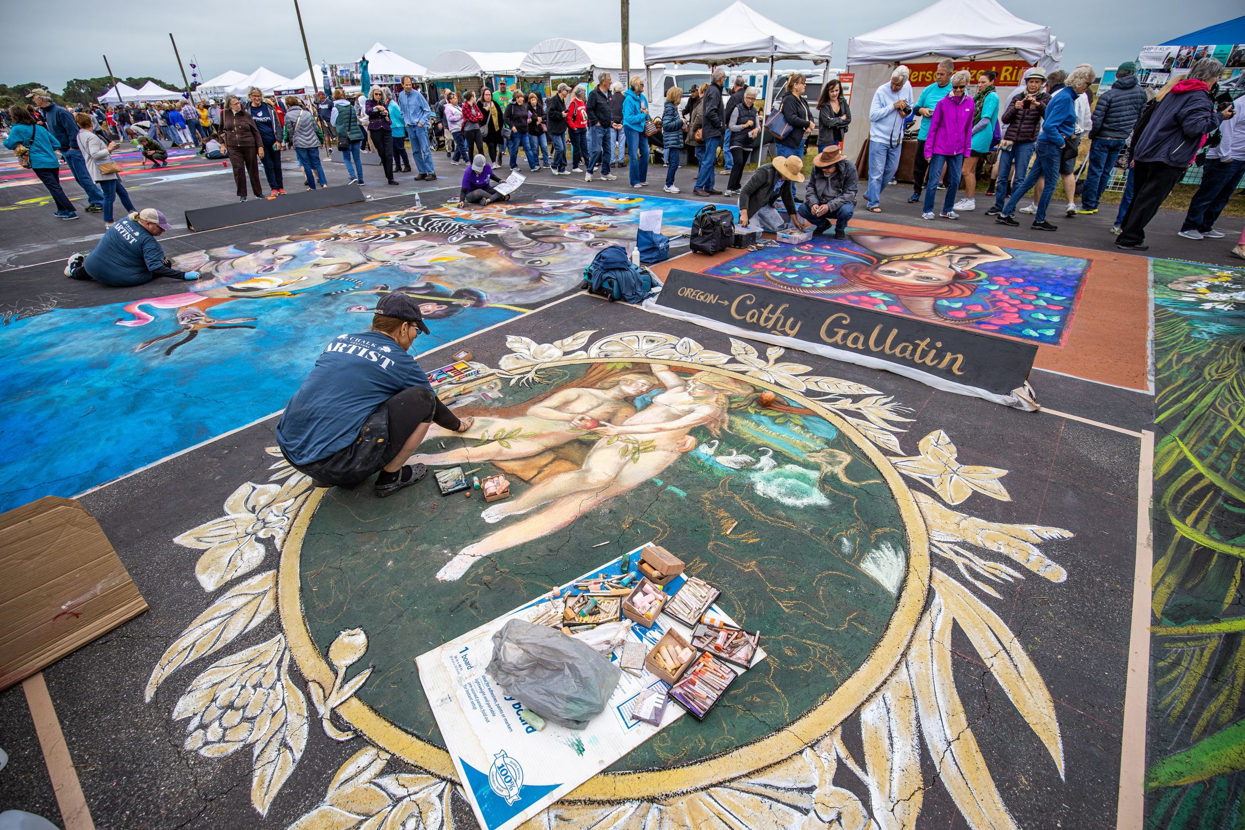 Chalk festival artists work on their commissioned pieces.