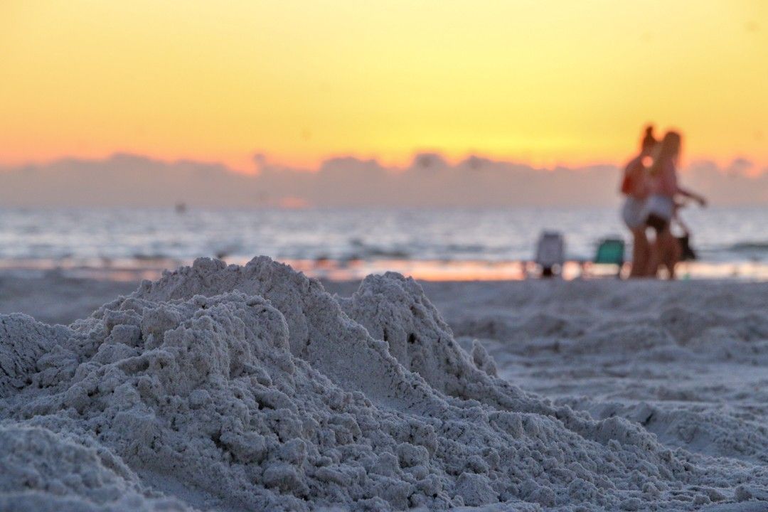 Smashed sandcastle on Lido Beach at sunset.