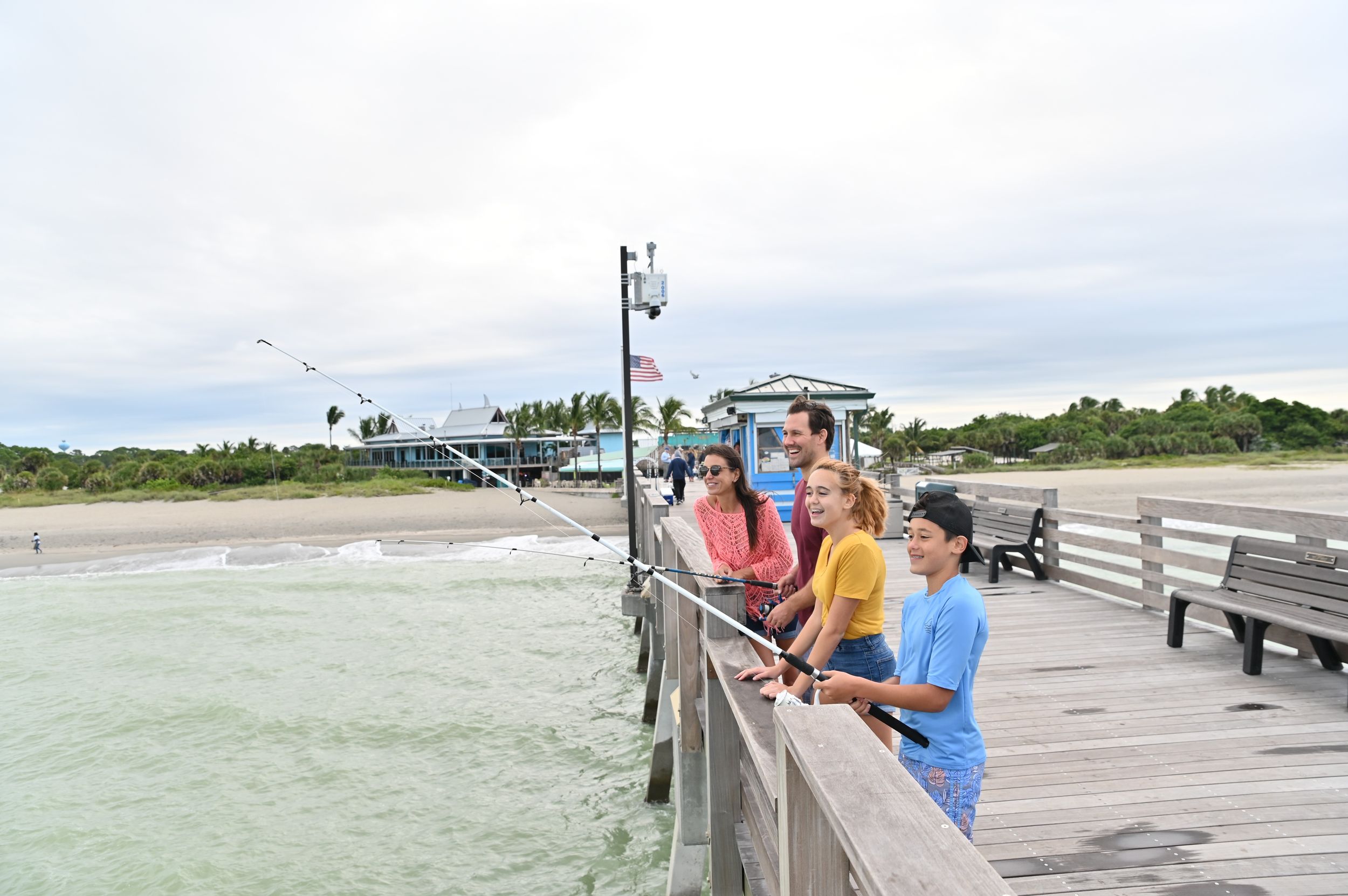 Family fishing at Venice pier.