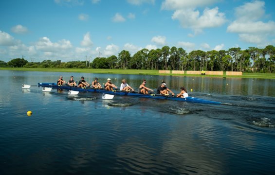 Crew team trains on a river.